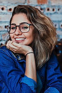 -closeup-photo-smiling-woman-wearing-blue-denim-jacket-1130626-jpg